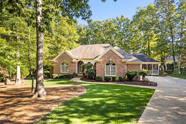 ranch-style house with a front lawn