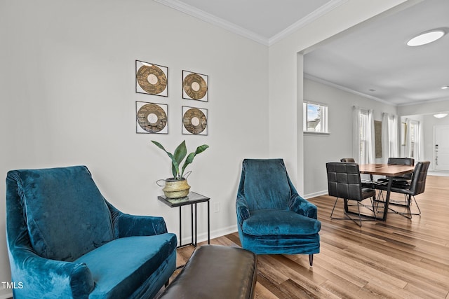 sitting room featuring crown molding and hardwood / wood-style floors