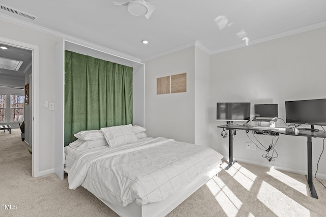 carpeted bedroom featuring crown molding