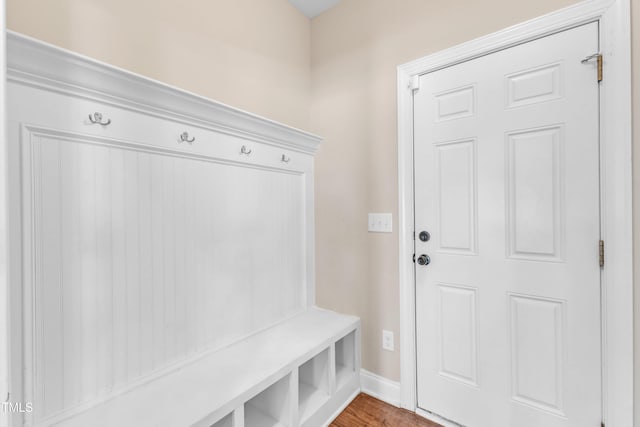 mudroom featuring baseboards and wood finished floors