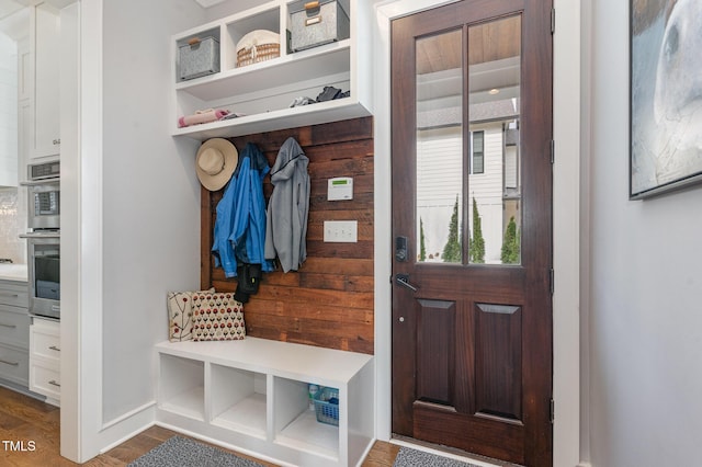 mudroom with dark hardwood / wood-style floors