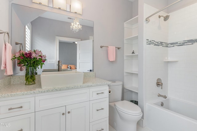 full bathroom featuring vanity, tiled shower / bath combo, toilet, and an inviting chandelier