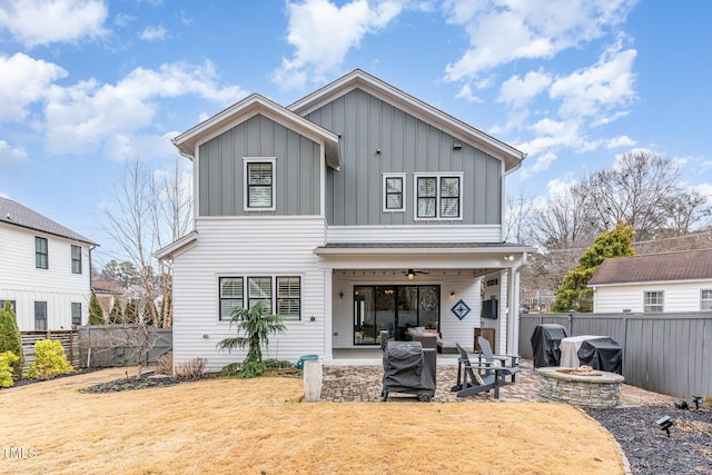 back of property featuring a patio and ceiling fan