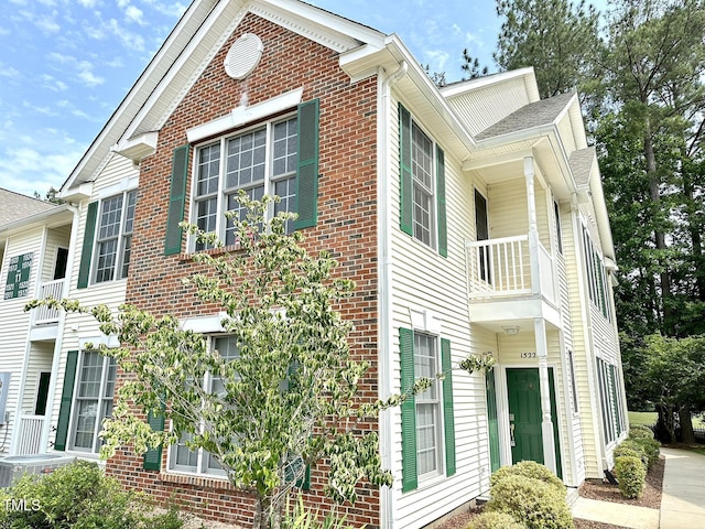 view of property exterior with a balcony