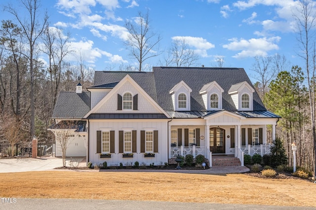 view of front facade with a garage and covered porch