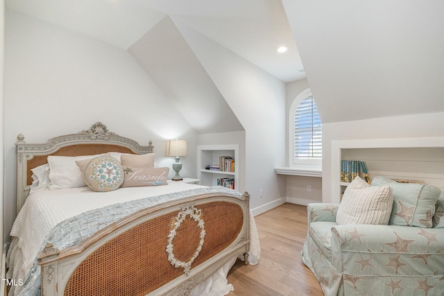 bedroom featuring lofted ceiling, recessed lighting, baseboards, and wood finished floors