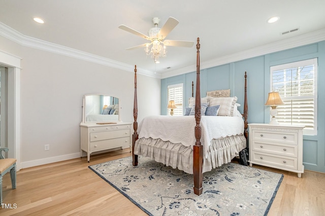 bedroom with crown molding, ceiling fan, and light wood-type flooring