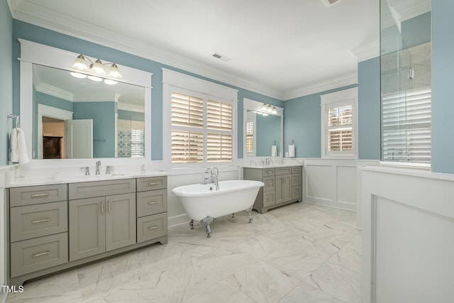 bathroom with ornamental molding, a bath, and vanity