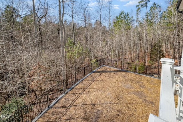 view of yard featuring a wooded view