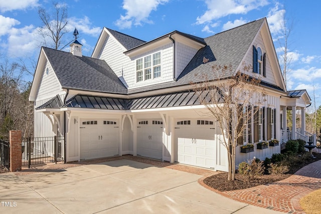 view of property exterior with driveway, a standing seam roof, metal roof, and roof with shingles