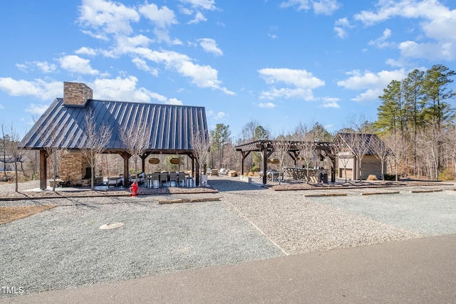 view of community featuring a gazebo and a pergola