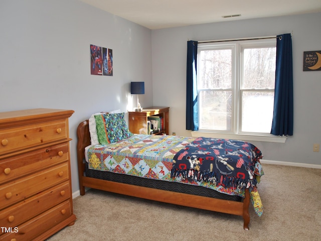 bedroom with light carpet, baseboards, and visible vents