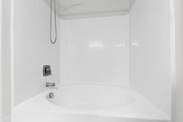 bathroom featuring washtub / shower combination