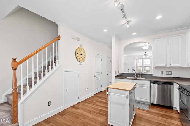 kitchen featuring white cabinetry, sink, dishwasher, and butcher block countertops