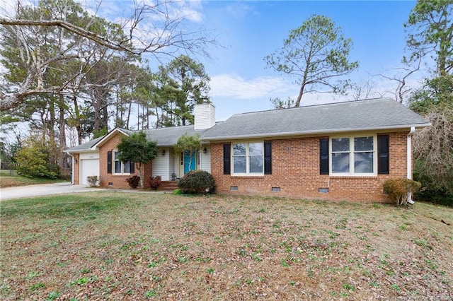 ranch-style home with a garage and a front yard