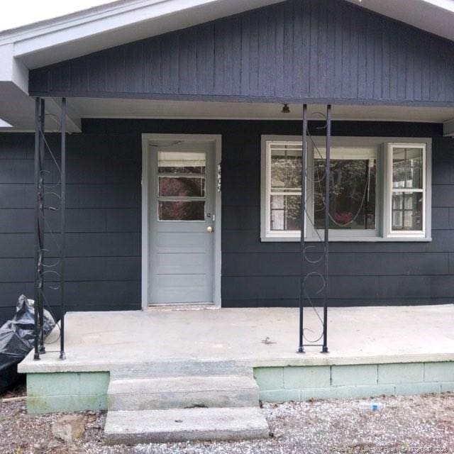 doorway to property with a porch