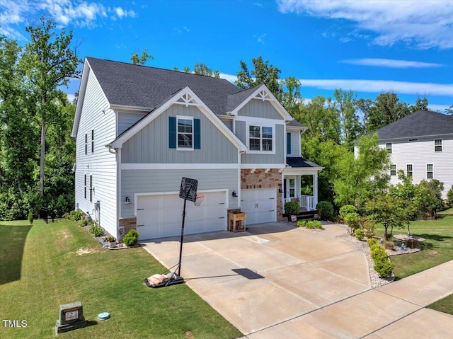 2981 Thurman Dairy Loop, Wake Forest, NC 27587 - craftsman-style home with stone siding, a garage, board and batten siding, and concrete driveway