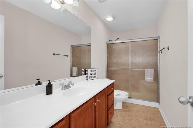 bathroom featuring vanity, toilet, an enclosed shower, and tile patterned flooring