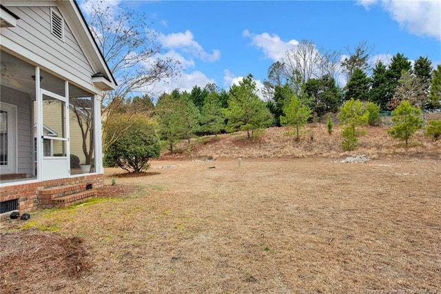 view of yard featuring a sunroom