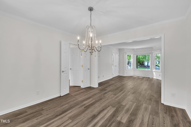 100 Windvale Ct, Cary, NC 27518 - empty room with a chandelier, dark wood-style flooring, baseboards, and ornamental molding