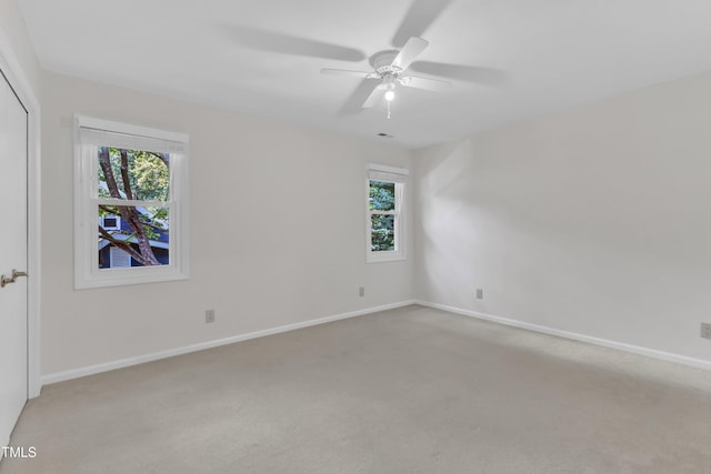 100 Windvale Ct, Cary, NC 27518 - unfurnished bedroom with light carpet, a closet, and a ceiling fan