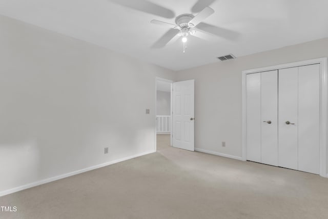 100 Windvale Ct, Cary, NC 27518 - unfurnished bedroom featuring carpet flooring, a closet, and a ceiling fan