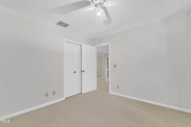 100 Windvale Ct, Cary, NC 27518 - unfurnished bedroom with a closet, carpet flooring, and a ceiling fan