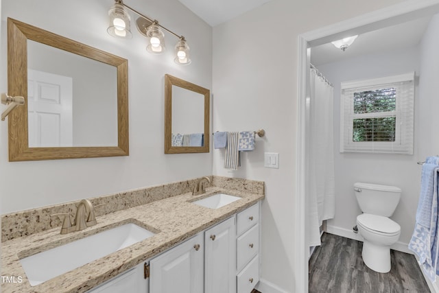 100 Windvale Ct, Cary, NC 27518 - bathroom with wood finished floors and double vanity