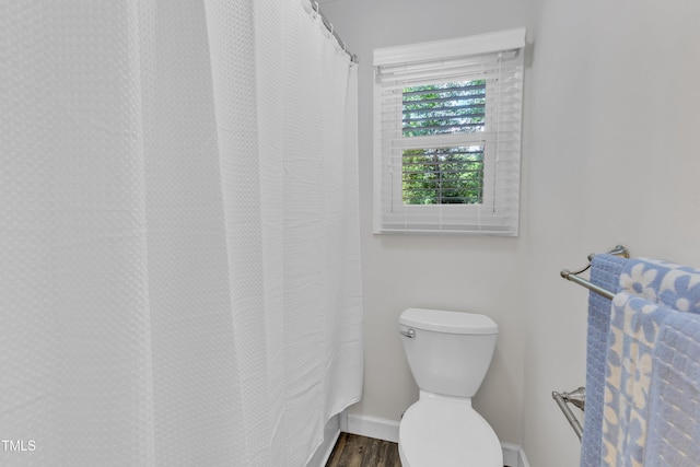 100 Windvale Ct, Cary, NC 27518 - full bathroom featuring wood finished floors and a shower with shower curtain