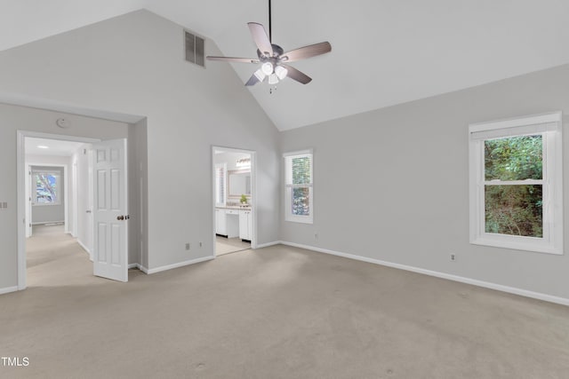 100 Windvale Ct, Cary, NC 27518 - unfurnished bedroom with high vaulted ceiling, light carpet, ceiling fan, and connected bathroom