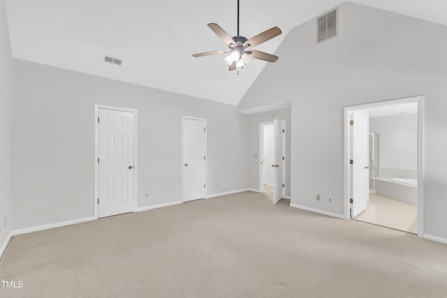 100 Windvale Ct, Cary, NC 27518 - unfurnished bedroom featuring high vaulted ceiling, light carpet, two closets, ensuite bath, and ceiling fan