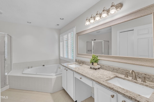 100 Windvale Ct, Cary, NC 27518 - full bath with a shower stall, a bath, double vanity, tile patterned floors, and recessed lighting