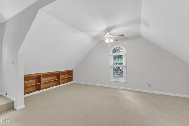 100 Windvale Ct, Cary, NC 27518 - bonus room featuring light colored carpet, a ceiling fan, lofted ceiling, and built in shelves