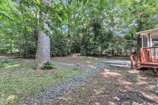 100 Windvale Ct, Cary, NC 27518 - view of yard featuring a sunroom and a wooden deck