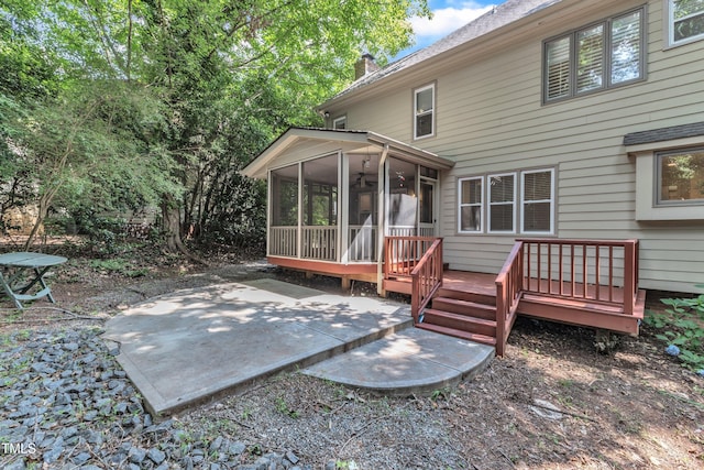 100 Windvale Ct, Cary, NC 27518 - back of house with a sunroom, a patio, a deck, and a chimney