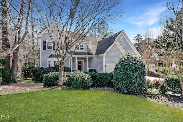 view of front facade with a garage and a front lawn