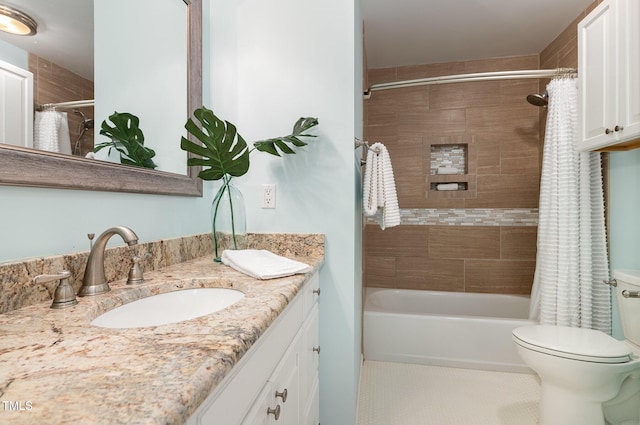 full bathroom with shower / bath combination with curtain, vanity, tile patterned flooring, and toilet