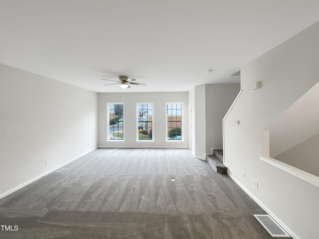 unfurnished living room featuring ceiling fan