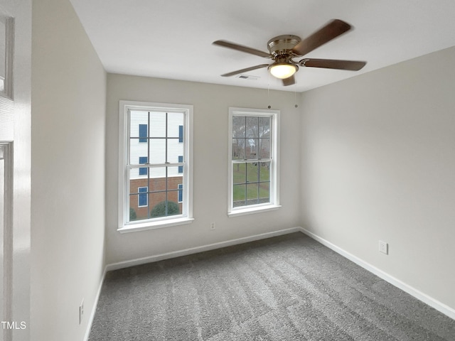 empty room with carpet floors and ceiling fan