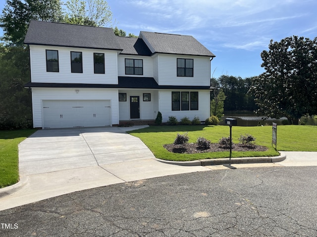 3204 Overlook Ct, Burlington, NC 27215 - view of front of house featuring a front lawn, driveway, and an attached garage