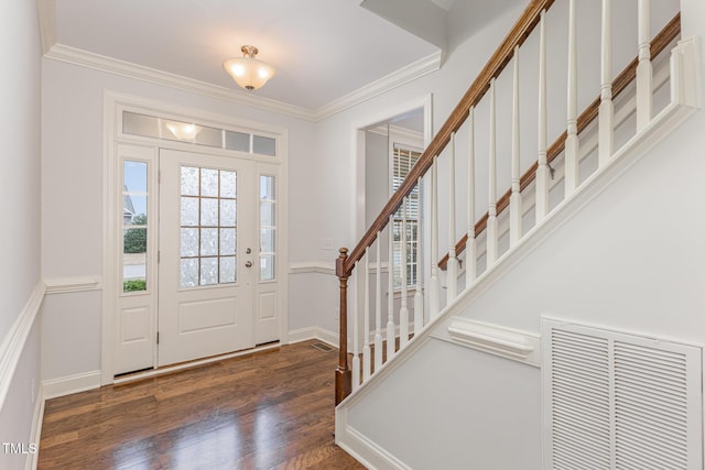 foyer featuring crown molding and dark hardwood / wood-style flooring