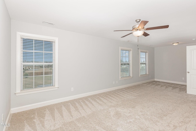 unfurnished room with carpet floors and ceiling fan