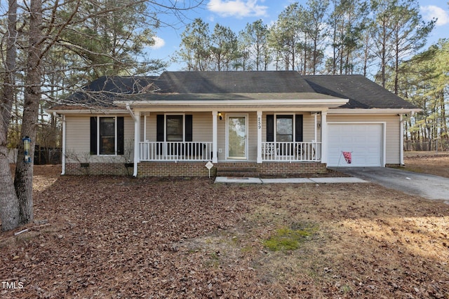 single story home with a garage and covered porch