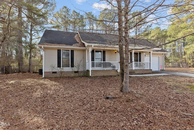 ranch-style home featuring a garage and a porch