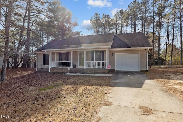 ranch-style home featuring a garage and a porch