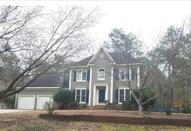 colonial-style house featuring a garage