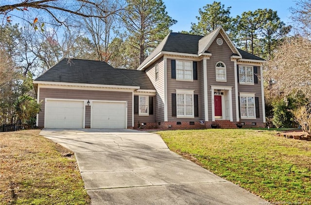 view of front of house featuring a garage and a front lawn