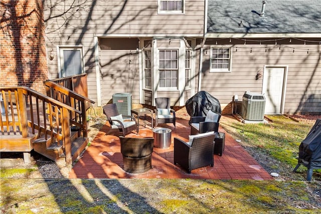 exterior space featuring an outdoor hangout area and central AC