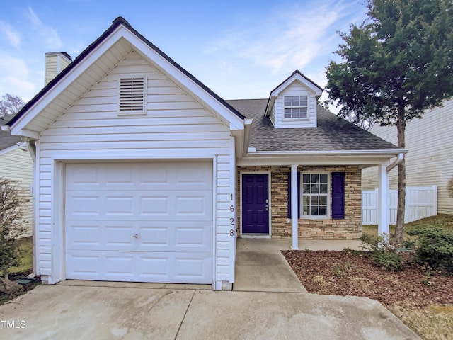 view of front facade featuring a porch and a garage