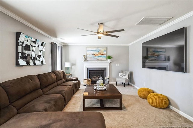 carpeted living room featuring ceiling fan and ornamental molding